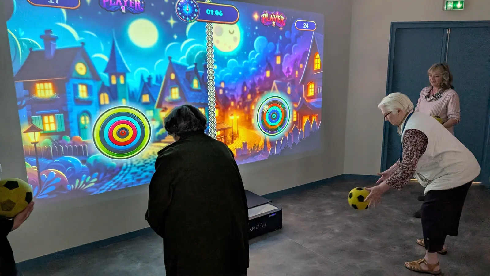 Résidents d'un EHPAD en séance d'activité physique adaptée devant le mur interactif Kmoove